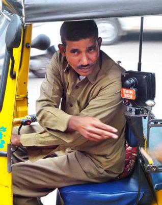 Javeed Khan, a multi-tasker, who works as a Home Guard, auto driver and Haleem server. He does all this just to earn enough to give a decent education to his four children. / Photo: Mohammed Yousuf / The Hindu