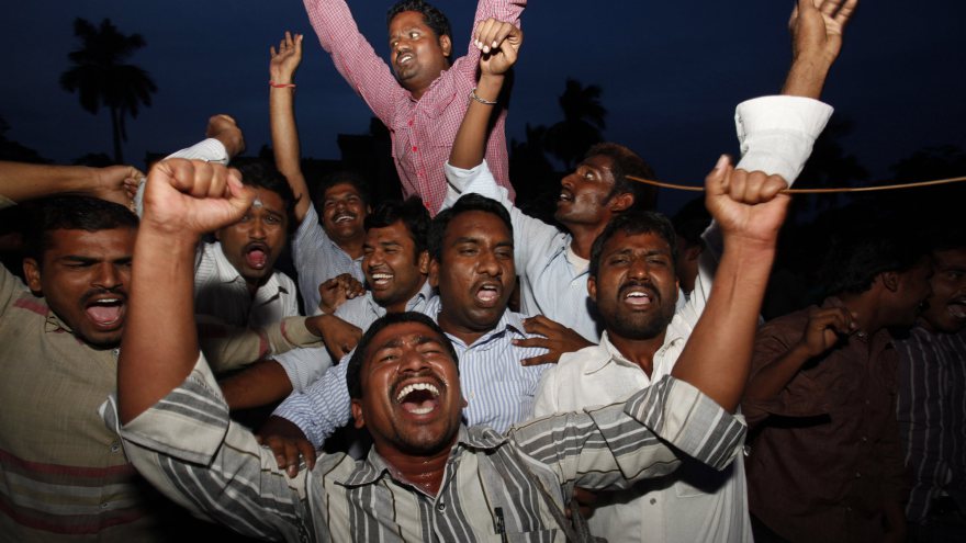 Students of Osmania University celebrate after India's ruling coalition endorsed the creation of the new state. AP Photo/Mahesh Kumar A.