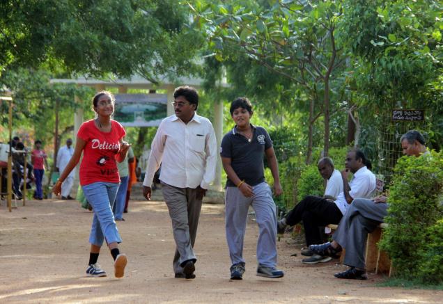 Walkers on a morning stroll at the walking track in Koretipadu in Guntur. / Photo: T Vijaya Kumar / The Hindu