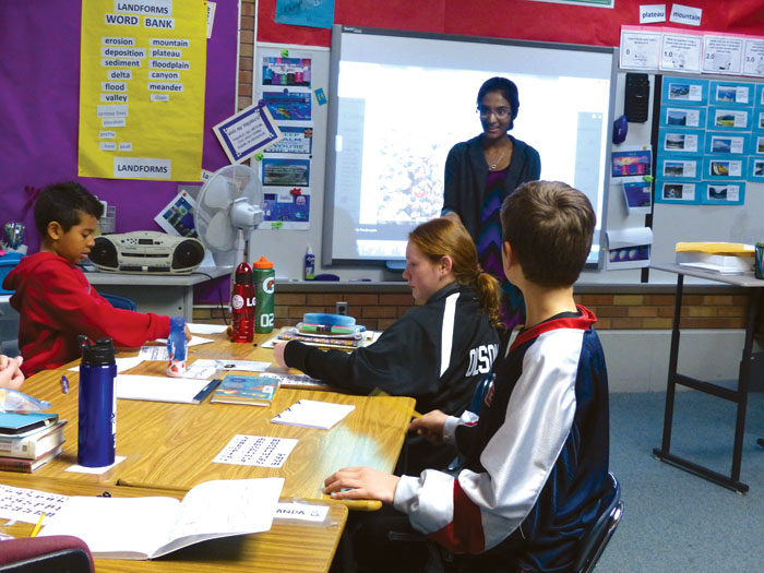 Chetana Guthikonda asks students in Laurie Miller’s fifth-grade class questions about the project after they finished.