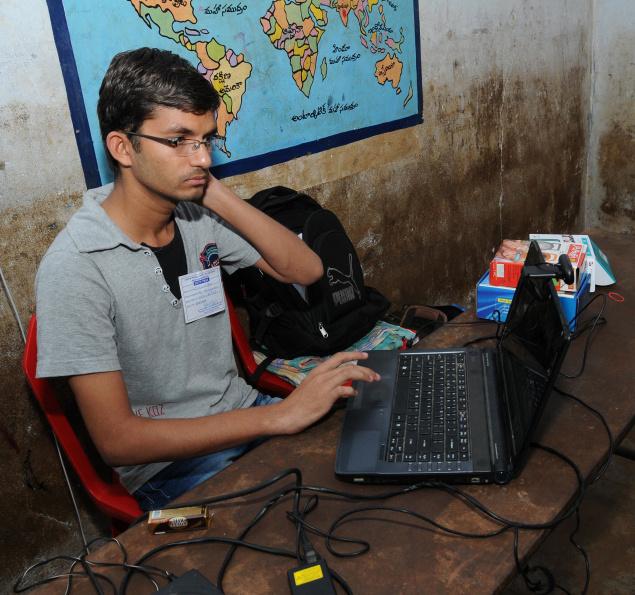 A file photo of a student webcasting the poll proceedings during the panchayat elections held in Krishna district. / The Hindu