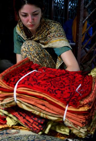 A foreigner selecting Kalamkari products at Pedana in Krishna district. / Photo: T Appala Naidu / The Hindu