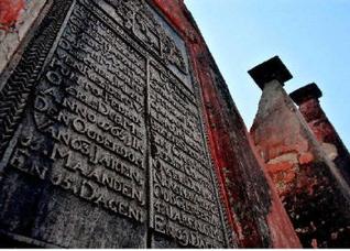 From the past Inscriptions in Dutch on a tombstone at the 18th century flagstaff cemetery in Bheemunipatnam, at left Gaali Meda (The round building) / The Hindu