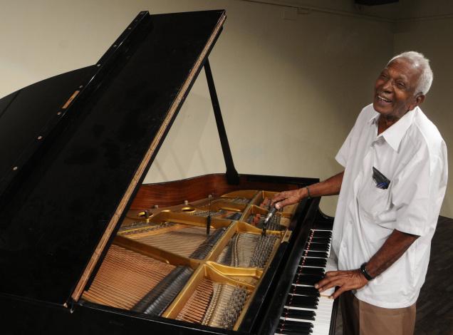 MASTER OF KEYS Venkateswara Rao at Max Mueller Bhavan with the first piano he tuned for Handel Manuel. Photo: R. Ragu / The Hindu