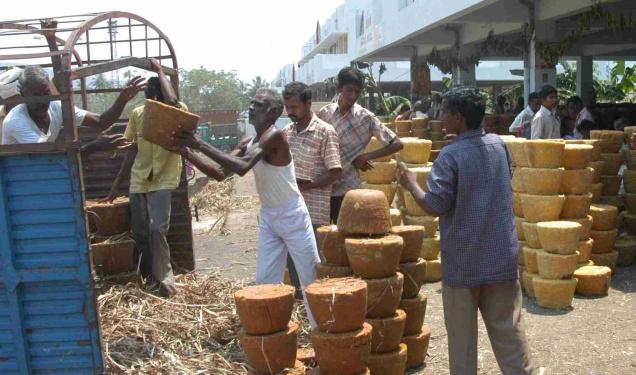 Jaggery stocks being loaded onto trucks at the Anakapalle market, in Visakhapatnam District. A file Photo: C.V. Subrahmanyam / The Hindu