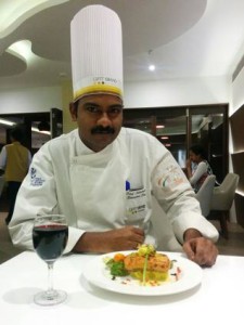 A chef with grilled Salmon dish at a hotel in Kakinada. Photo: K.N. Murali Sankar