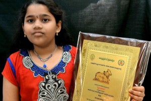 Kavya Priva with the Nandi award for the Best Child Artiste.- Photo: T. Vijaya Kumar