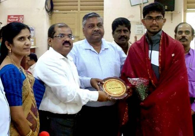 Proud moment: Joint Collector Md.Imtiyaz Ahmed felicitating K. Raja who scaled Mount Everest